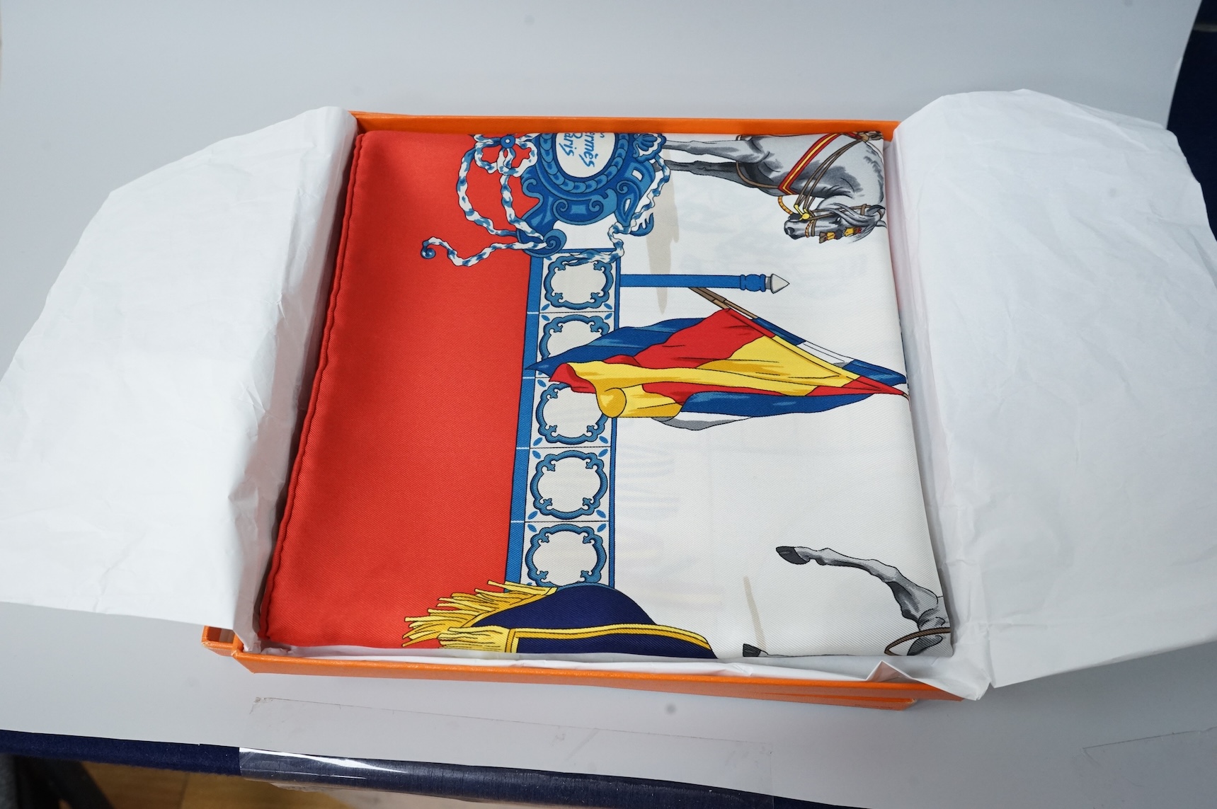 Two boxed Hermes silk scarves comprising ‘Real Escuela Andaluza del Arte Equestre’ and ‘Equateur’, with original boxes, together with four Hermes gentleman’s silk ties